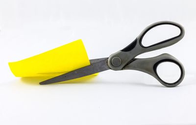 High angle view of yellow representation against blue background