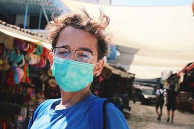 Young man wearing mask standing outdoors