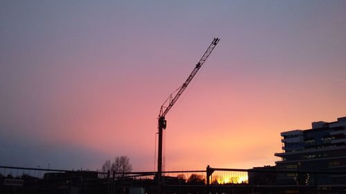 Silhouette of city at sunset
