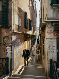 People walking on sidewalk in city