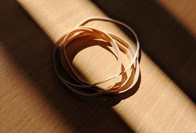 High angle view of rubber bands on table