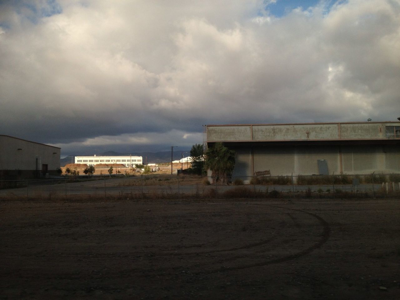 sky, cloud - sky, architecture, cloudy, built structure, building exterior, weather, cloud, overcast, storm cloud, house, transportation, outdoors, day, nature, no people, beach, sand, road, dusk