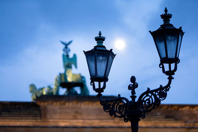 Low angle view of street light against sky