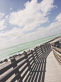 Scenic view of sea against cloudy sky