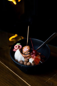 Ice dessert with sweet toppings, burnt marshmallow, colored cereal, chocolate cereal, panda-shaped