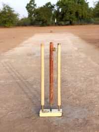 Close-up of cricket stumps on field