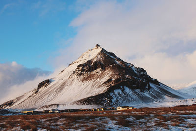 Scenic view of snowcapped mountains against sky