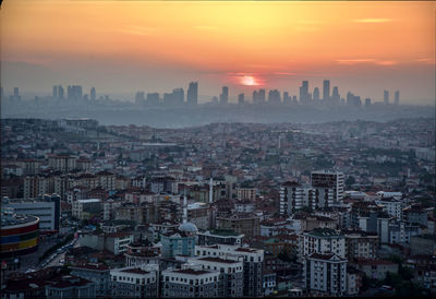 High angle view of city buildings during sunset