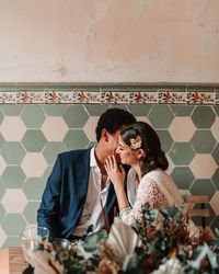 Young couple sitting on table in restaurant