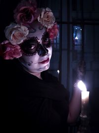 Portrait of woman with red flower