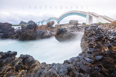 View of arch bridge over water