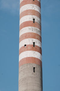 Low angle view of lighthouse against blue sky