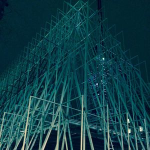 Low angle view of illuminated building against sky