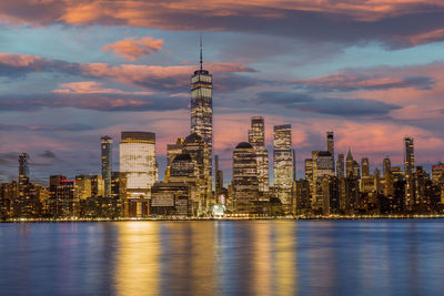 Illuminated city at waterfront