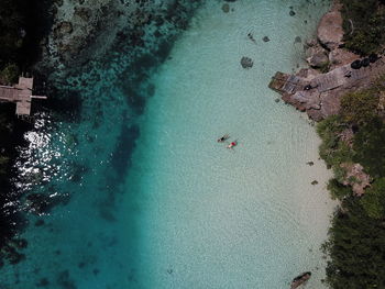 High angle view of people swimming in sea