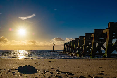 Scenic view of beach against sky during sunset