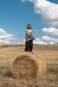 Full length of man standing on field against sky