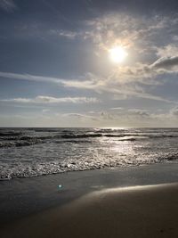 Scenic view of beach at sunset