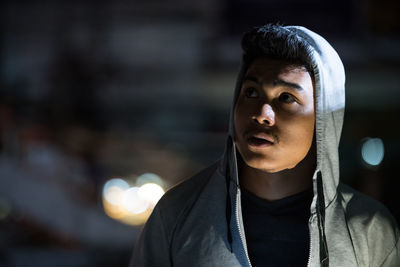 Portrait of young man looking away