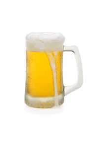 Close-up of beer glass against white background