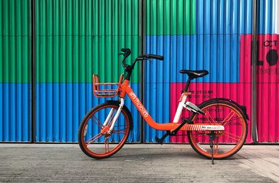 Bicycle parked against wall