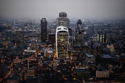 Aerial view of city lit up at night