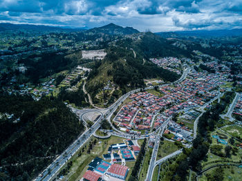 High angle view of city buildings against sky