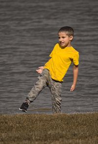 Full length of boy enjoying in water