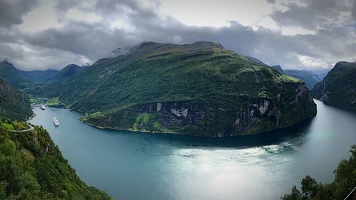 Panoramic shot of river amidst trees against sky