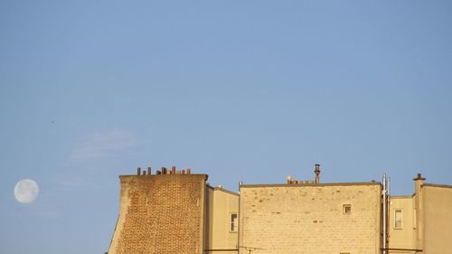 Low angle view of buildings against clear sky