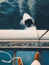 Low section of man on boat in sea