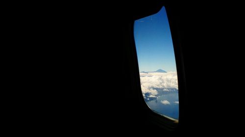 Scenic view of mountains seen through airplane window