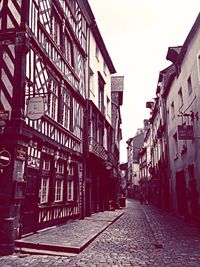 Alley amidst buildings in city