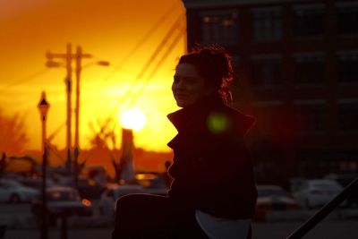 Woman looking at sunset