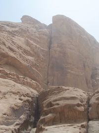 Low angle view of rock formation against clear sky