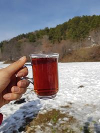 Close-up of hand holding drink