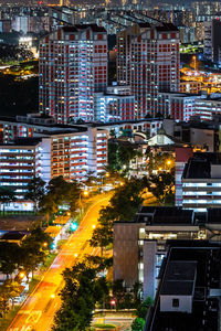 High angle view of illuminated buildings in city at night