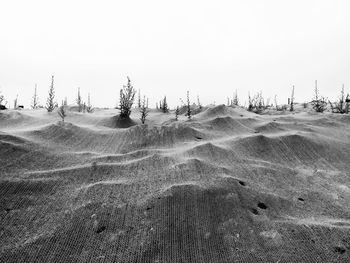 Scenic view of landscape against sky during winter