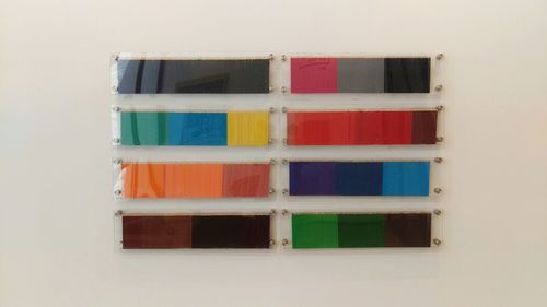Multi colored chairs against white background