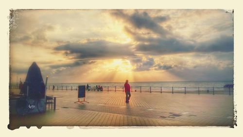 Scenic view of sea against cloudy sky