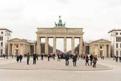 Statue in front of historical building