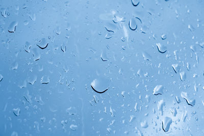 Full frame shot of wet glass window