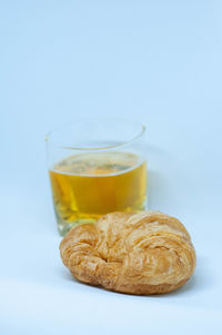 Close-up of drink against white background
