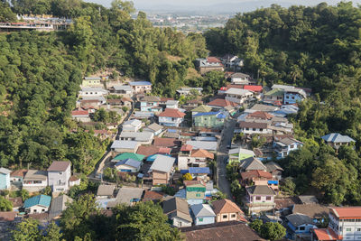 High angle view of houses and trees in town
