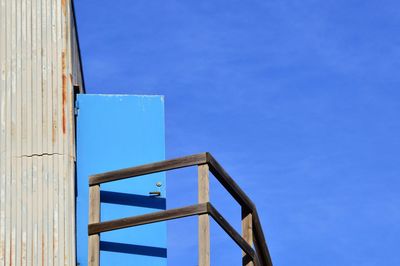 Low angle view of building against clear blue sky