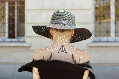 Rear view of woman wearing hat