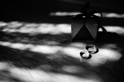 Close-up view of wedding rings on table