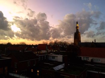 High angle view of houses against sky during sunset