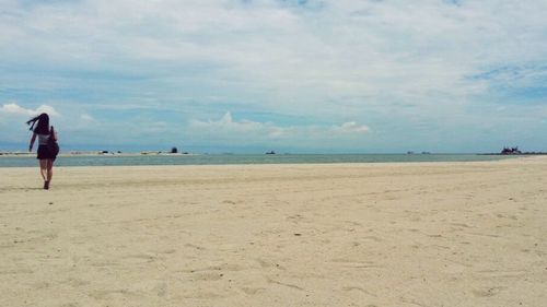 Silhouette of woman on beach