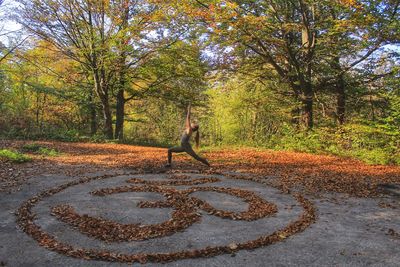 Woman doing yoga in forest